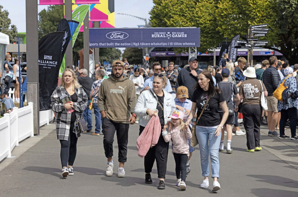 People walking through the Rural Games event entrance.