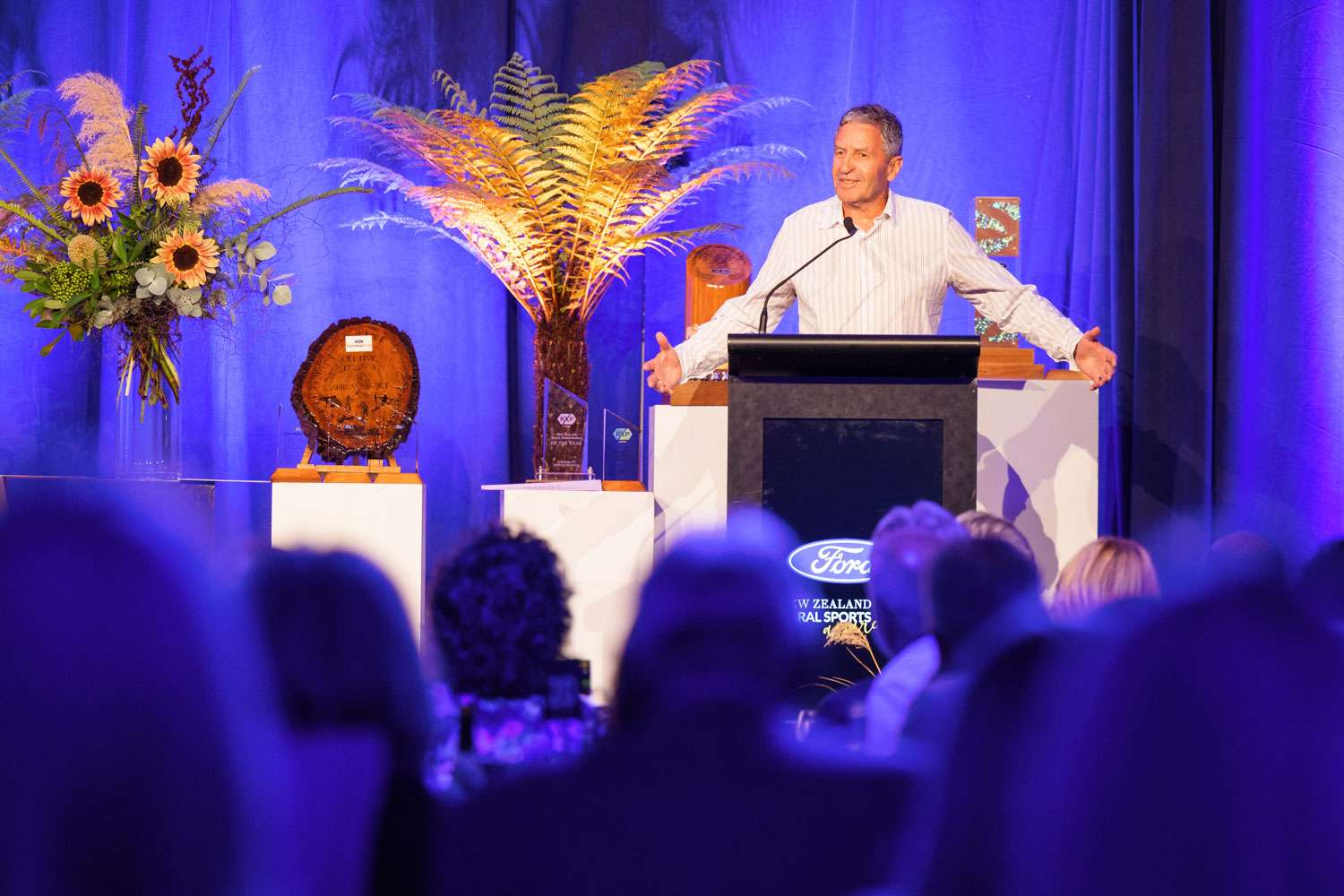 A person giving a speech at the Rural Sports Awards