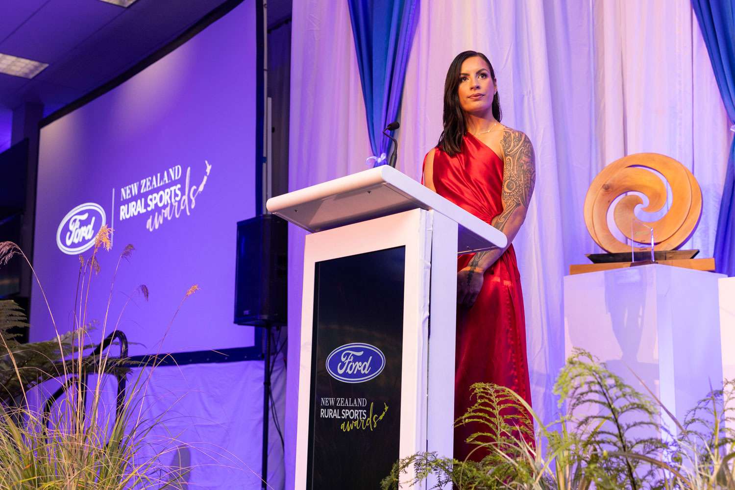 A person giving a speech at the Rural Sports Awards