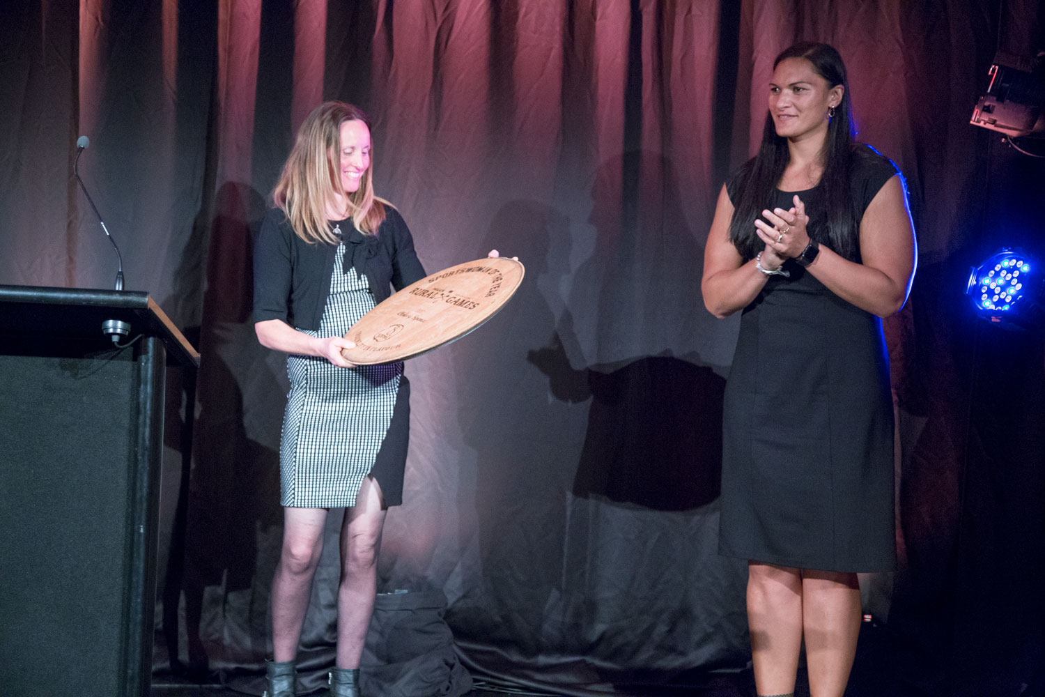Two people on stage at the Rural Sports awards