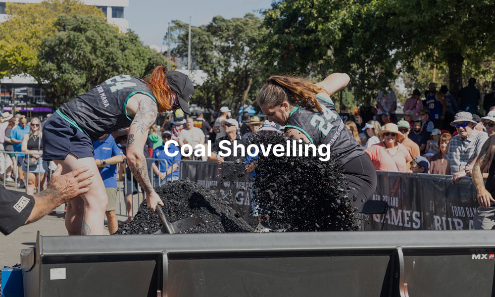 Two competitors shovelling coal at the NZ Rural Games with overlay text that reads, "Coal Shovelling"