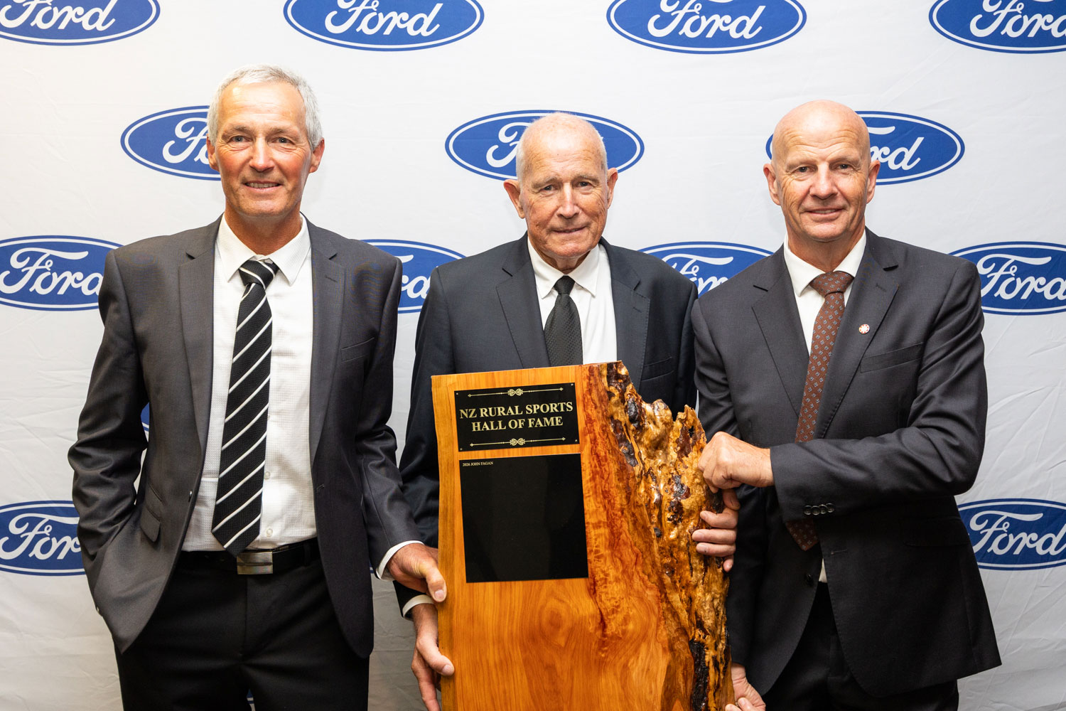 John Fagan holding the NZ Rural Sports hall of fame award