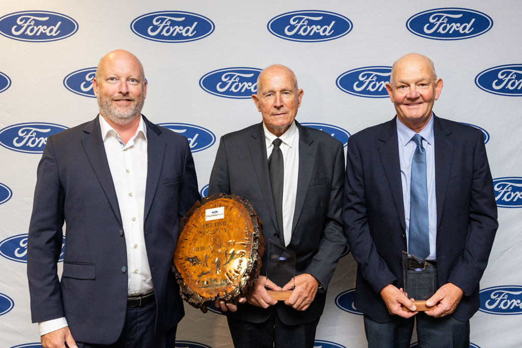 John Fagan standing with two other award recipients at the NZ Rural Sports Awards
